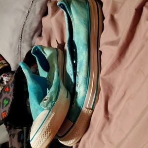 Bright blue Coverse All Star shoes. lovingly worn but in still good condition.